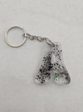 A 'Groovy' Keychain- Clear with Black Glitter