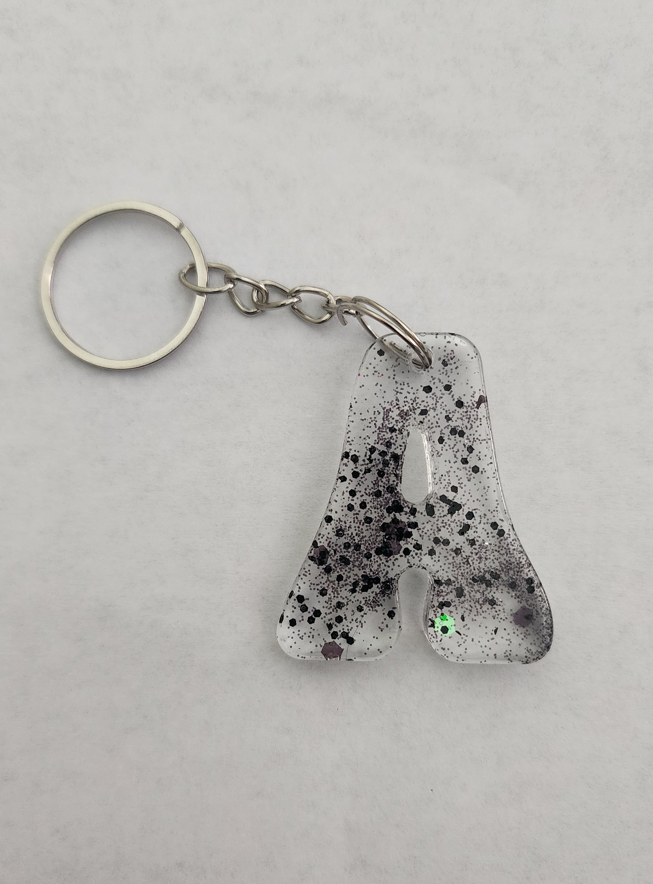 A 'Groovy' Keychain- Clear with Black Glitter