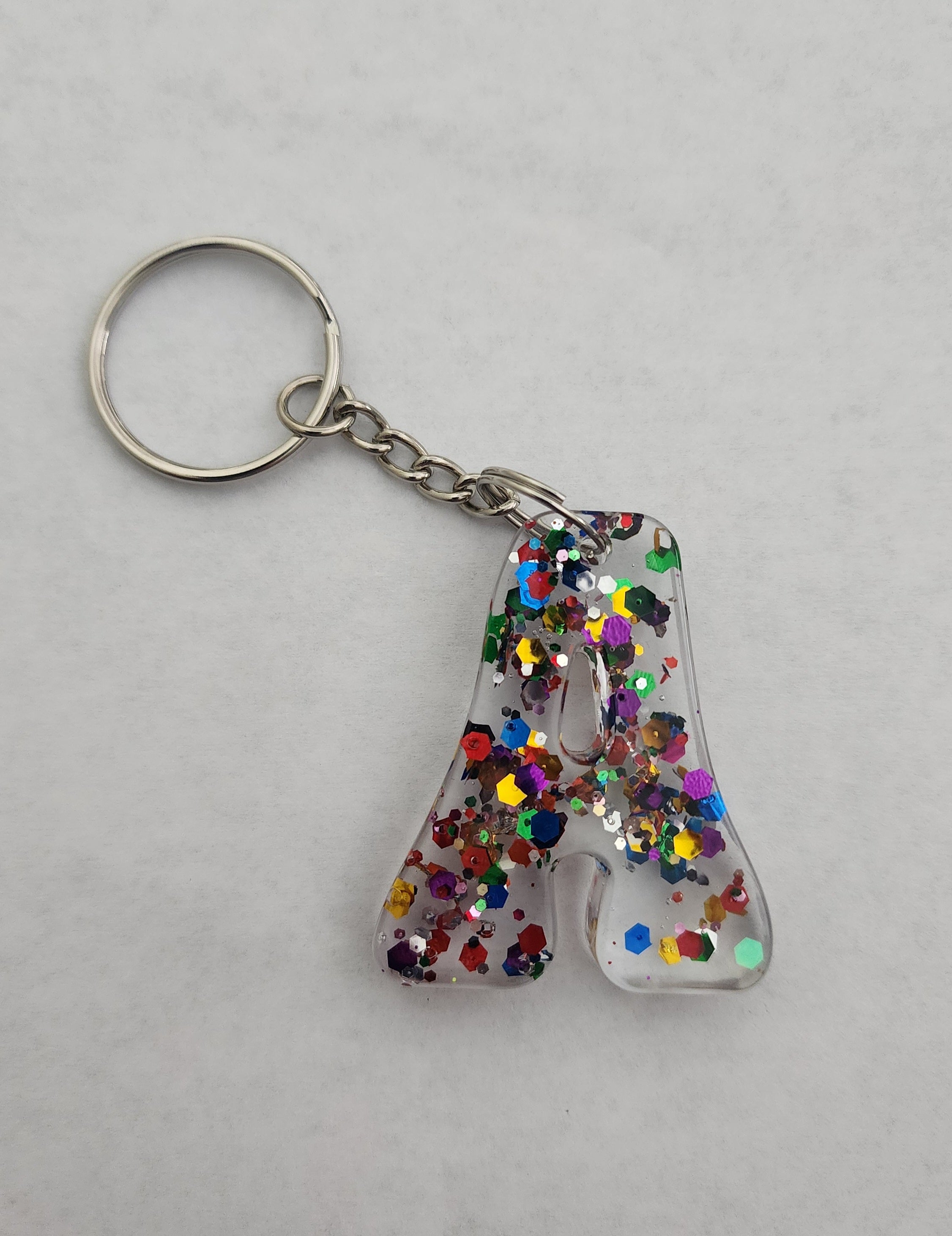 A 'Groovy' Keychain- Clear with Rainbow Glitter