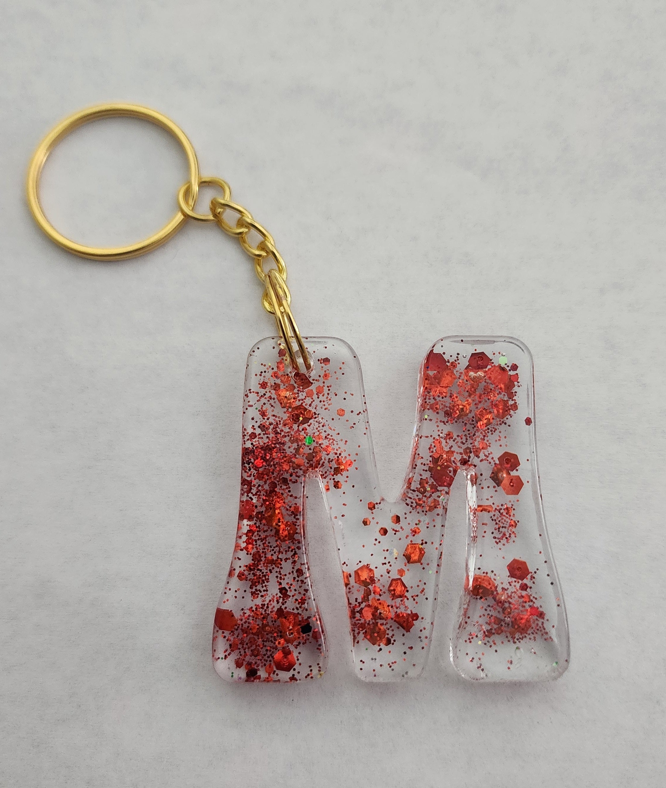 M 'Groovy' Keychain- Clear with Red Glitter