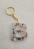 B Keychain- Clear with Rainbow Glitter