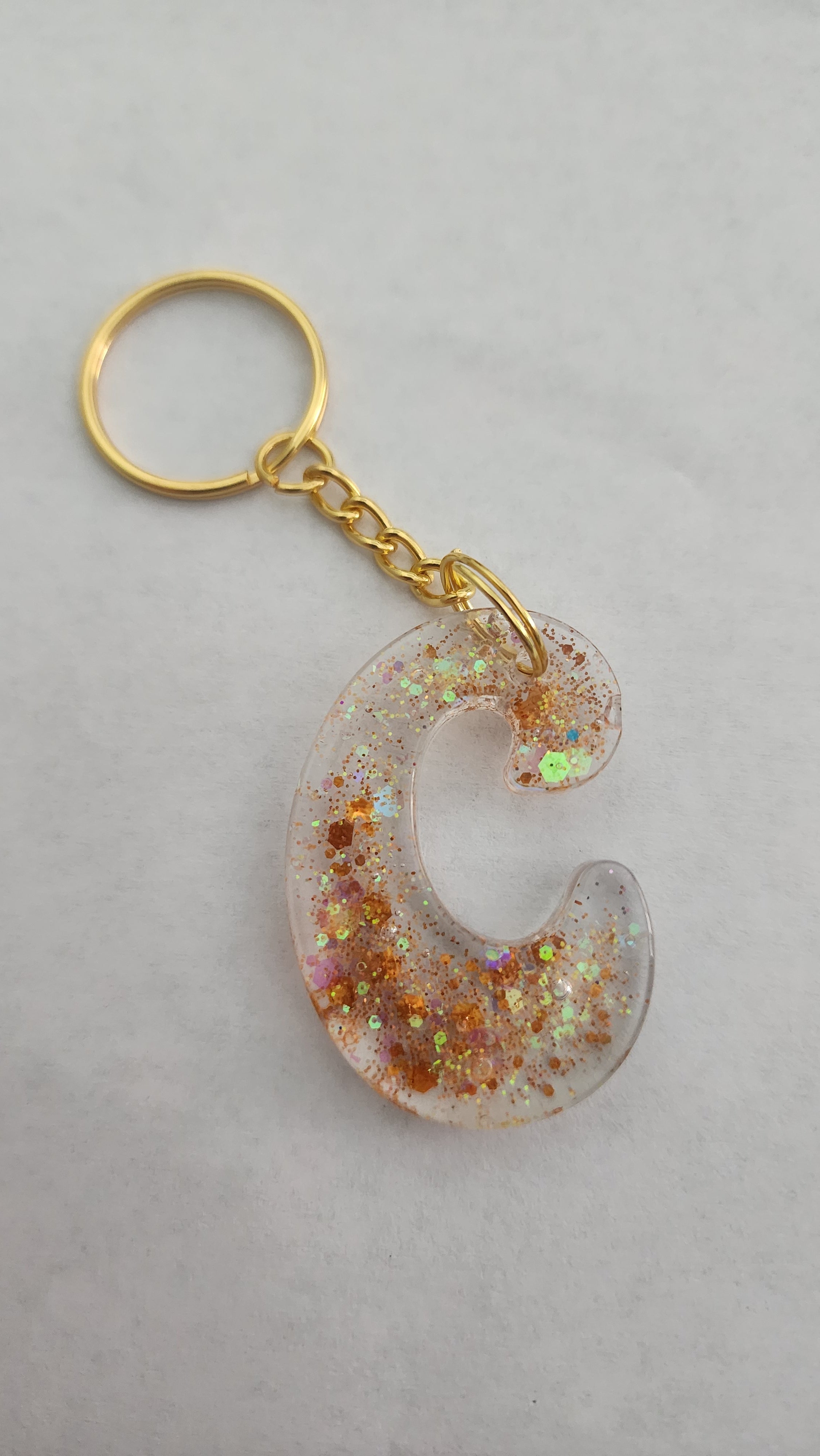 C 'Groovy' Keychain-Clear with Orange Glitter