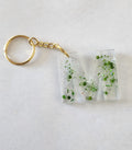 M Keychain-  Clear with Green Glitter