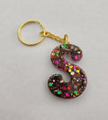 S 'Groovy' Keychain- Rainbow Glitter