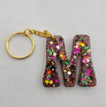M 'Groovy' Keychain- Rainbow Glitter