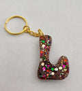L 'Groovy' Keychain with Rainbow Glitter