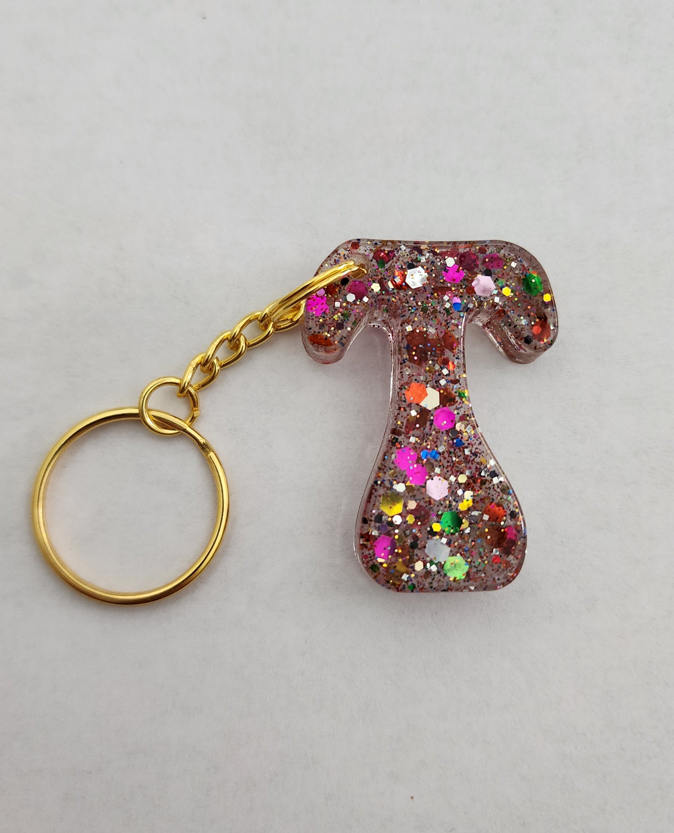 T 'Groovy' Keychain with Rainbow Glitter