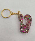 V 'Groovy' Keychain Clear with Rainbow Glitter