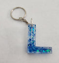 L Keychain with Blue Glitter