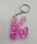 K 'Groovy' Keychain with Pink Glitter