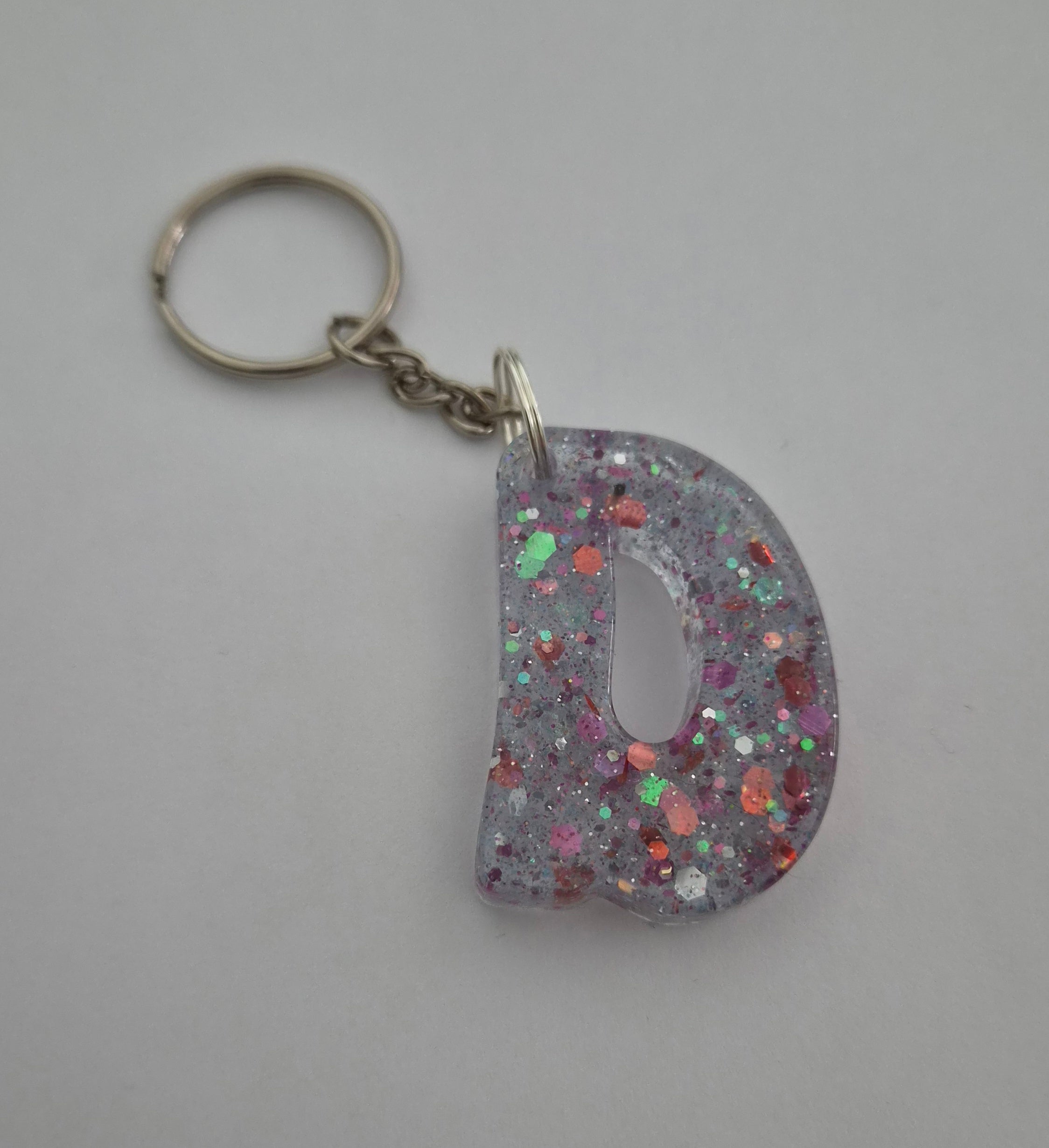 D 'Groovy' Keychain- Clear with Rainbow Glitter