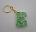 E 'Groovy' Keychain Green with Green Glitter
