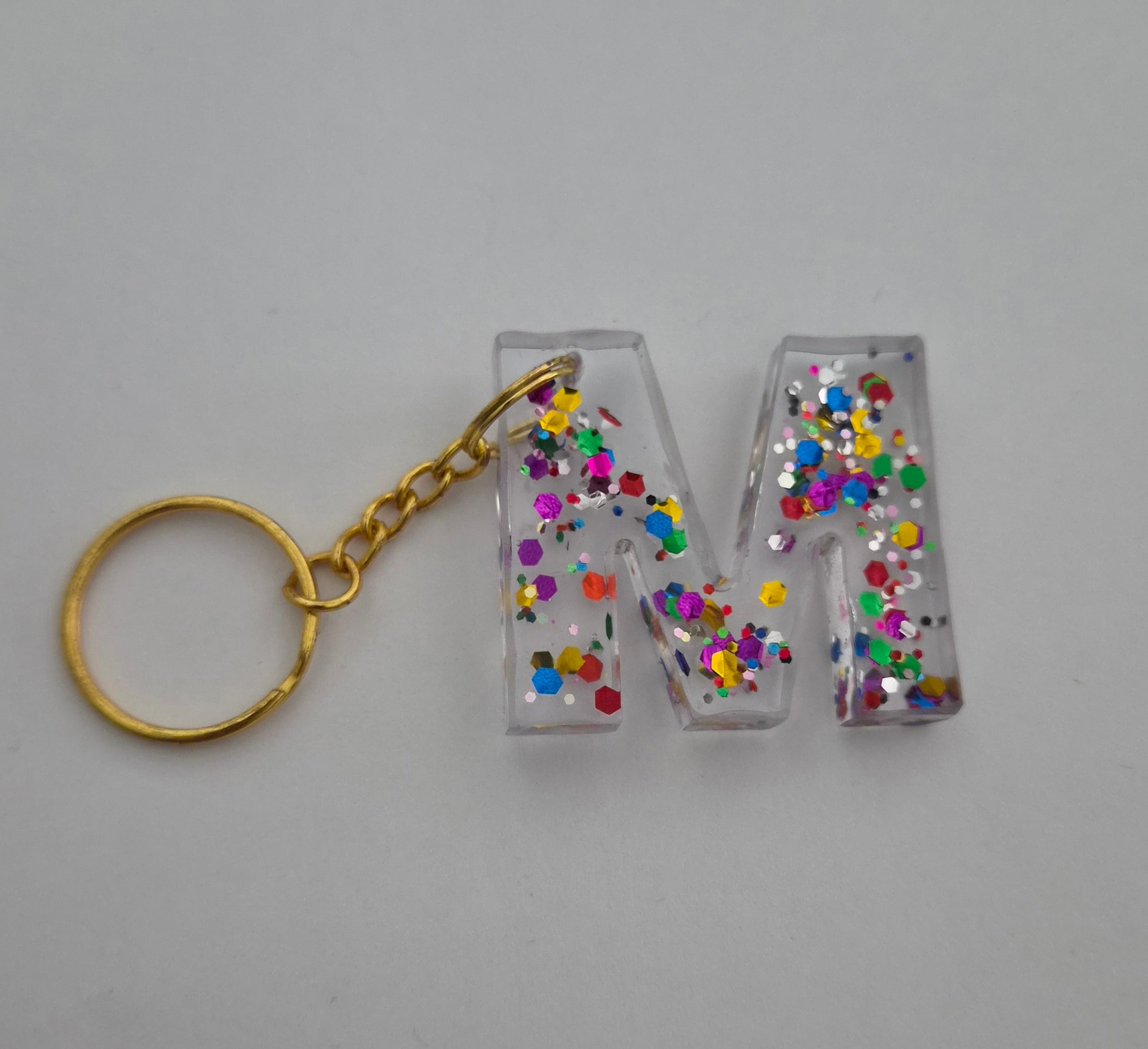 M Keychain Clear with Rainbow Glitter