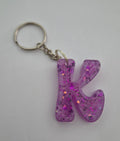 K 'Groovy' Keychain Pink with Purple Glitter